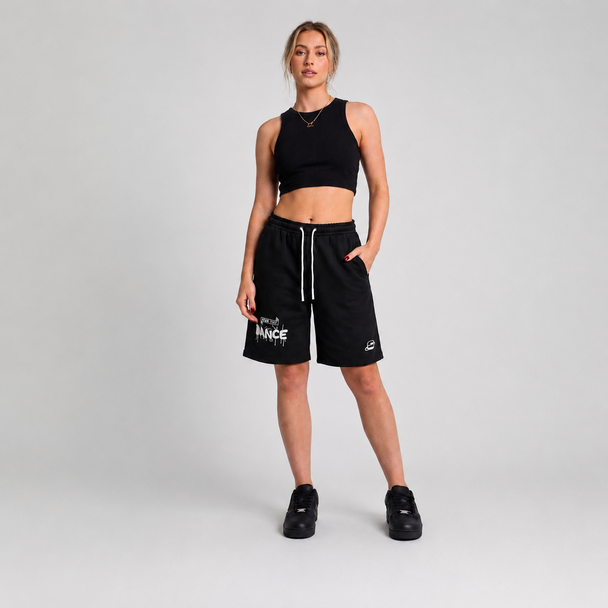 Black premium shorts with an elastic waistband and drawcord, styled for streetwear and relaxed fit.