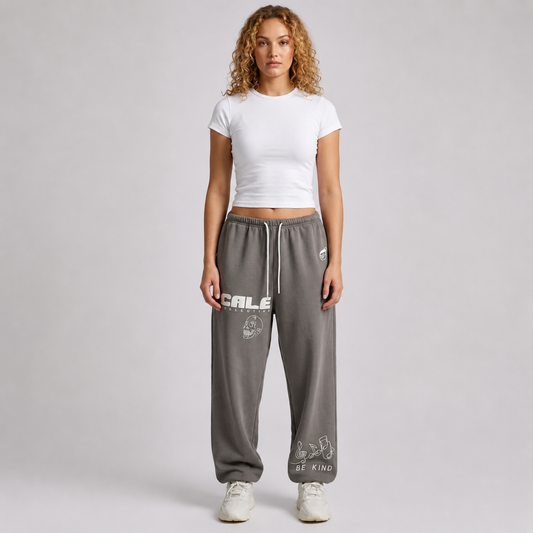 Black streetwear track pants by Cale Collective