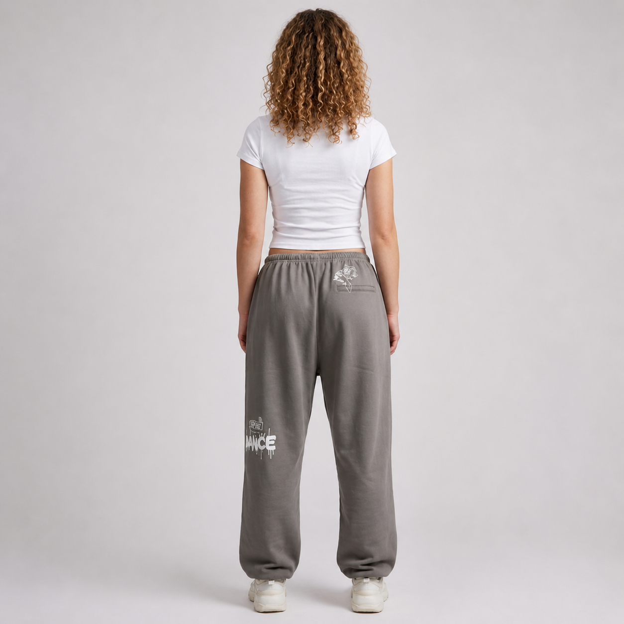 Black streetwear track pants by Cale Collective