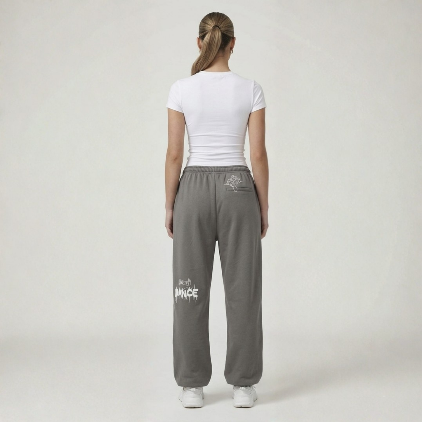Black streetwear track pants by Cale Collective