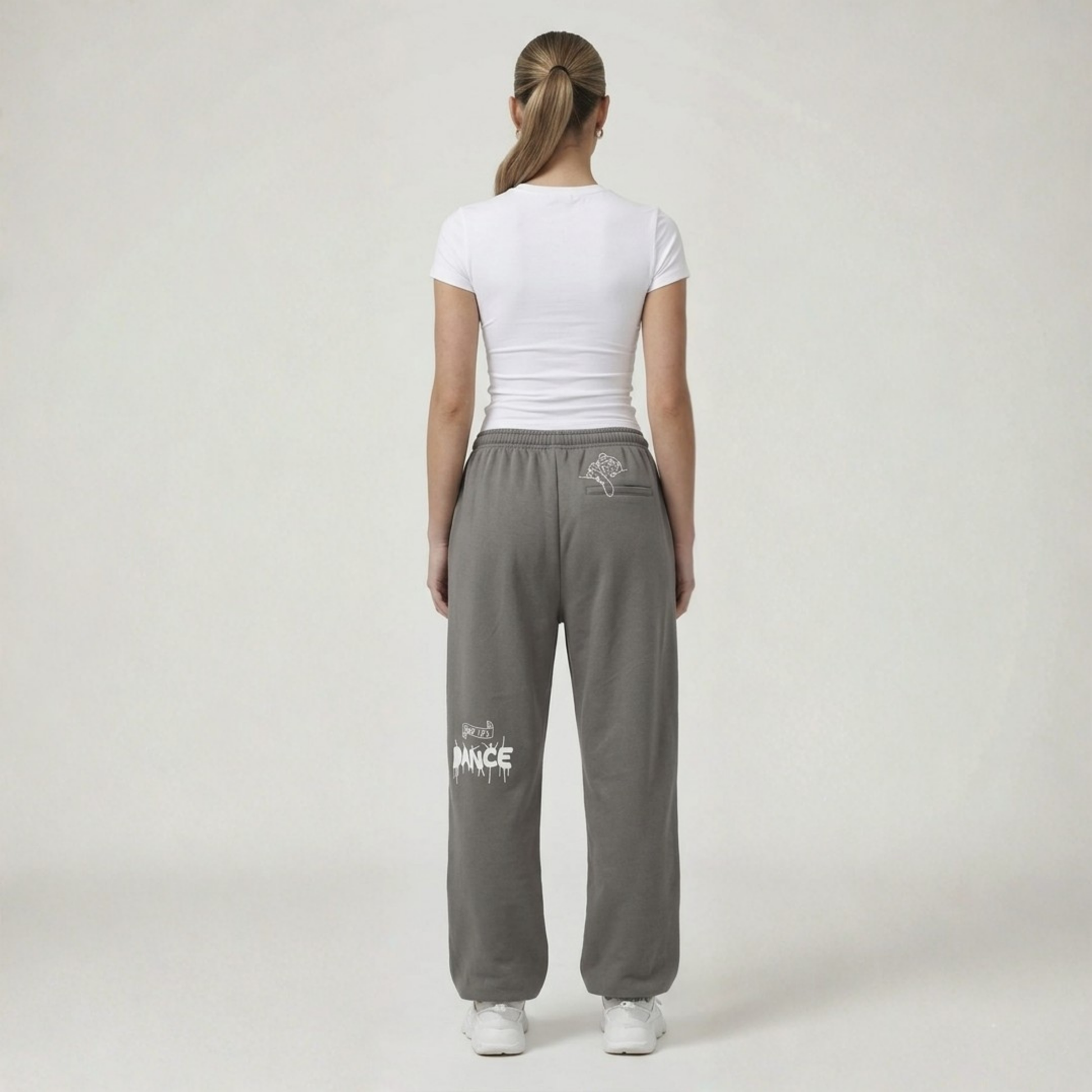 Black streetwear track pants by Cale Collective