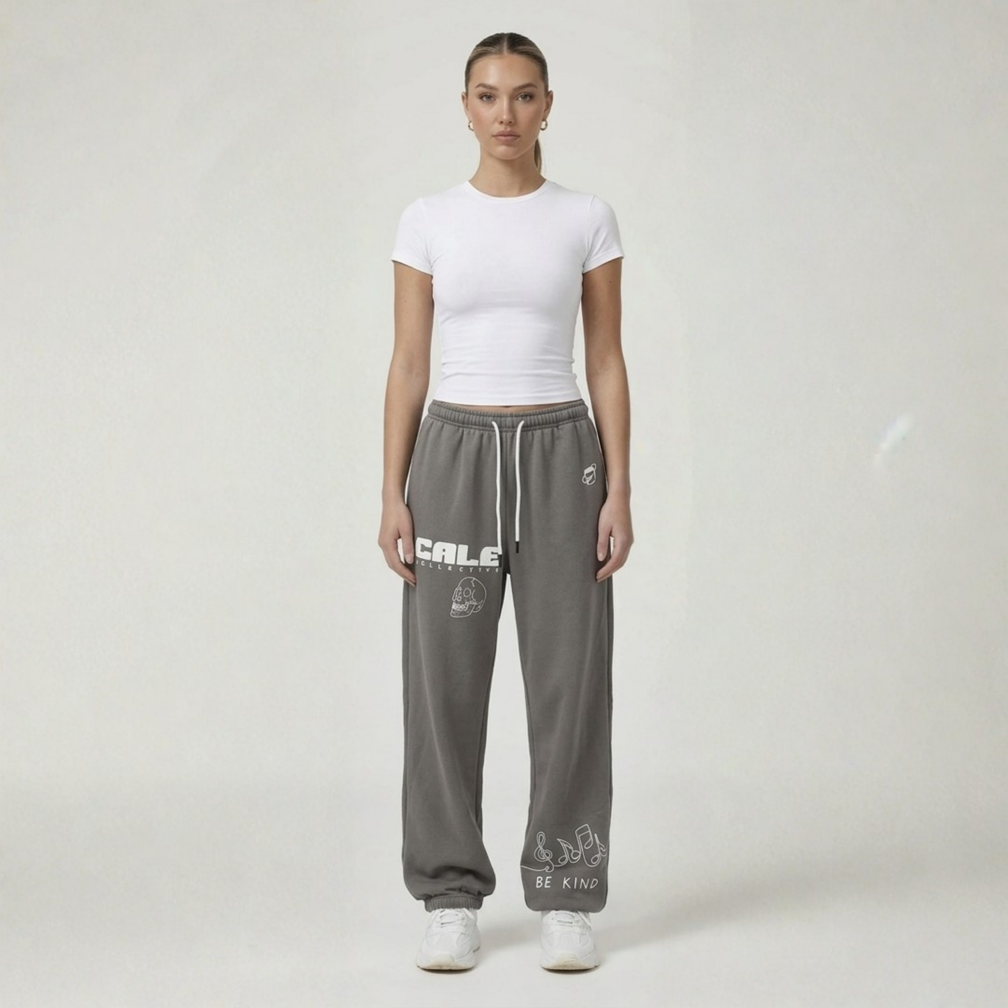 Black streetwear track pants by Cale Collective